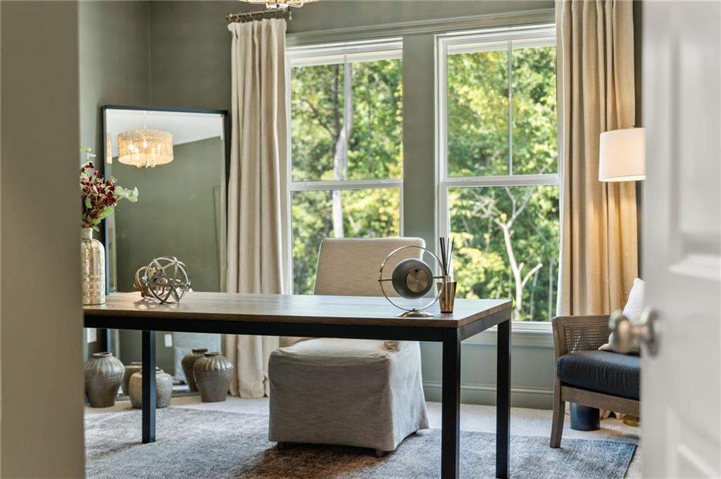 719 Crest Line Trail Powder Springs, GA 30127 - Photo 22 of 29 a view of a dining room with furniture and a window