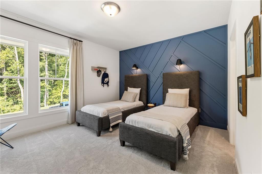 719 Crest Line Trail Powder Springs, GA 30127 - Photo 26 of 29 a bedroom with bed and a large window