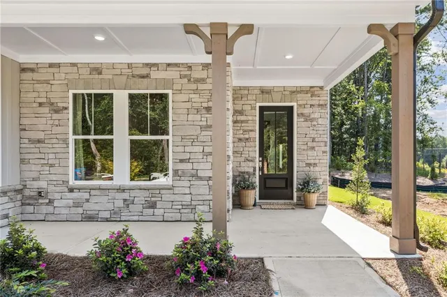 a front view of a house with a porch