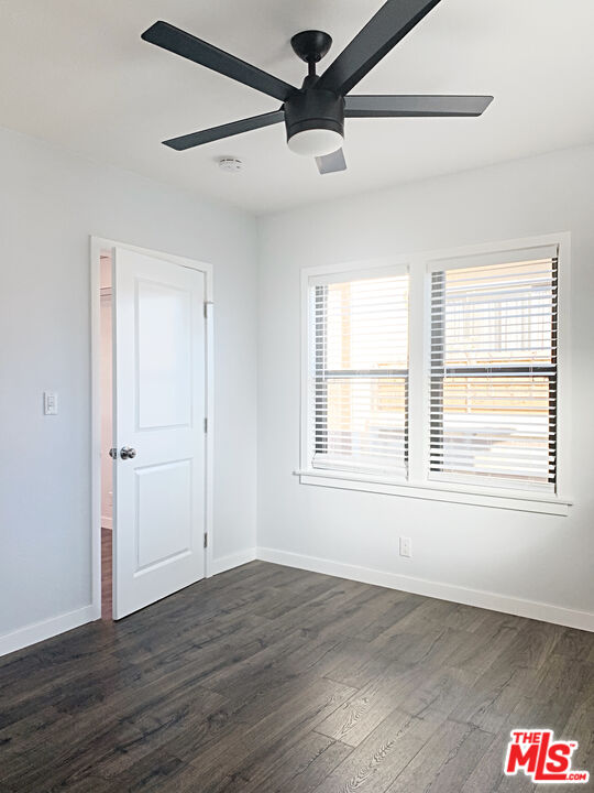908 North Louise Street, Unit 2 Glendale, CA 91207 - Photo 12 of 15 a view of an empty room with wooden floor and a window