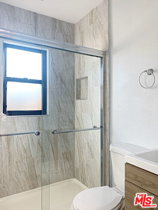 908 North Louise Street, Unit 2 Glendale, CA 91207 - Photo 13 of 15 a bathroom with a toilet and a shower