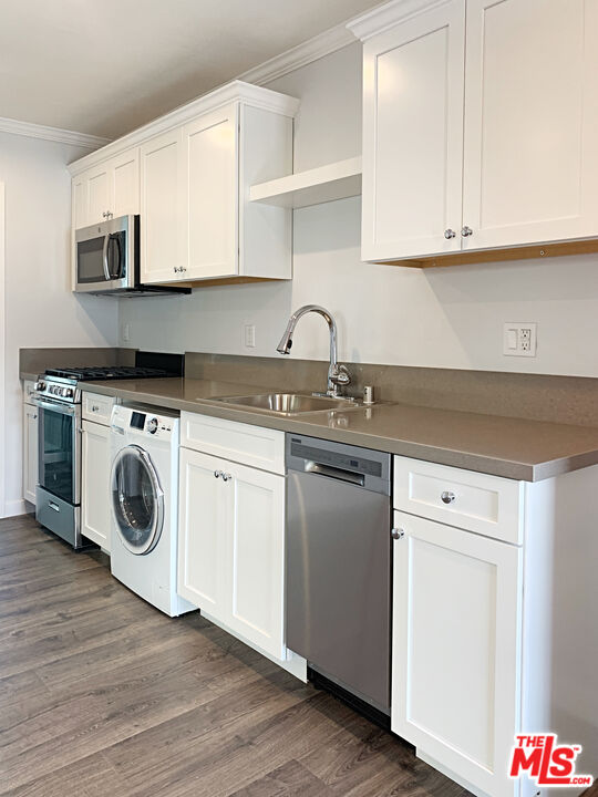 908 North Louise Street, Unit 2 Glendale, CA 91207 - Photo 5 of 15 a kitchen with granite countertop white cabinets and white appliances