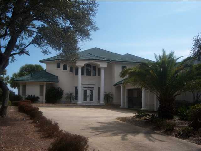 267 Country Club Road Shalimar, FL 32579 - Photo 1 of 21 a front view of a house with a yard