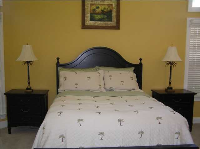 267 Country Club Road Shalimar, FL 32579 - Photo 4 of 21 a bedroom with a bed and a dresser