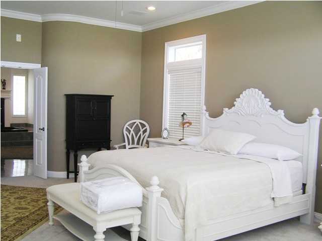 267 Country Club Road Shalimar, FL 32579 - Photo 10 of 21 a bedroom with a bed and a couch