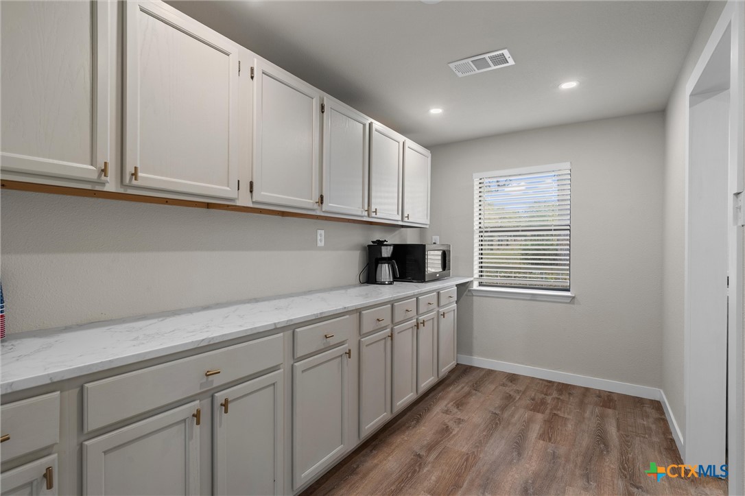 836 Cottle Town Road Smithville, TX 78957 - Photo 29 of 47 a kitchen with cabinets and window