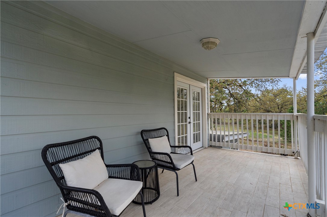 836 Cottle Town Road Smithville, TX 78957 - Photo 34 of 47 a view of a chair and table in the balcony