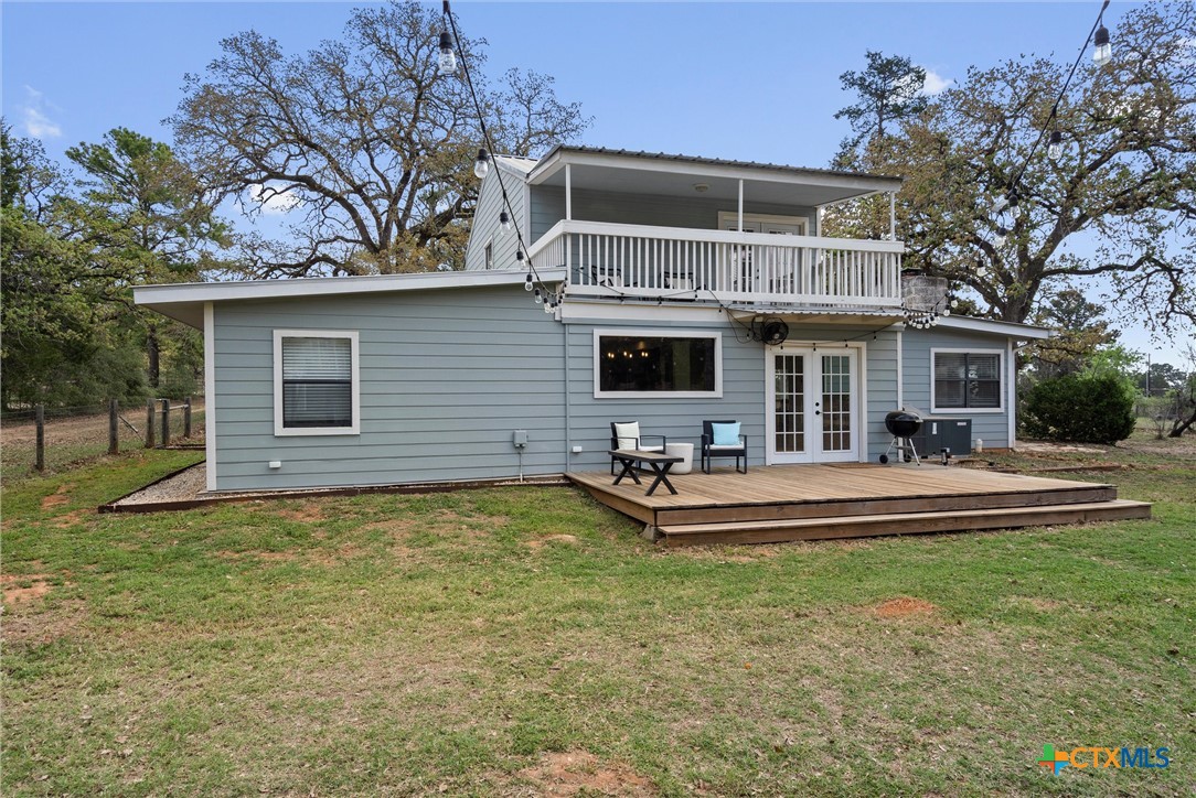 836 Cottle Town Road Smithville, TX 78957 - Photo 41 of 47 a front view of a house with swimming pool having outdoor seating