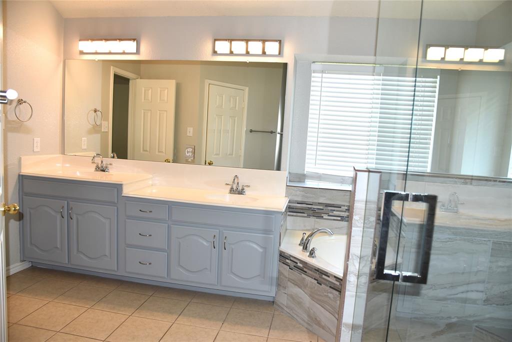 1526 Pebblestone Court Allen, TX 75002 - Photo 14 of 28 Dual vanity with light gray cabinetry and integrated sinks