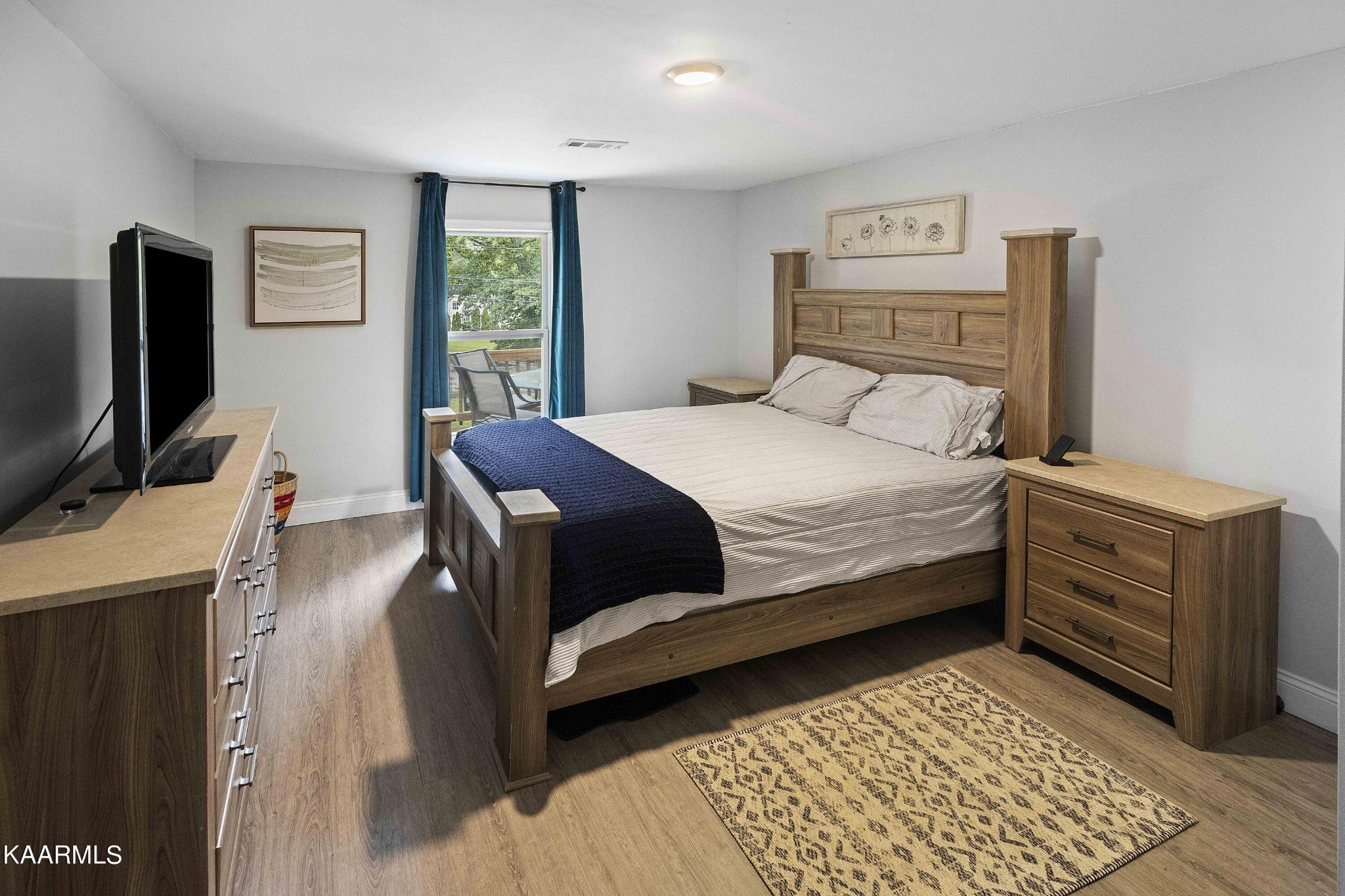 1000 Tarklin Valley Road Knoxville, TN 37920 - Photo 15 of 26 a bedroom with a bed and a flat screen tv