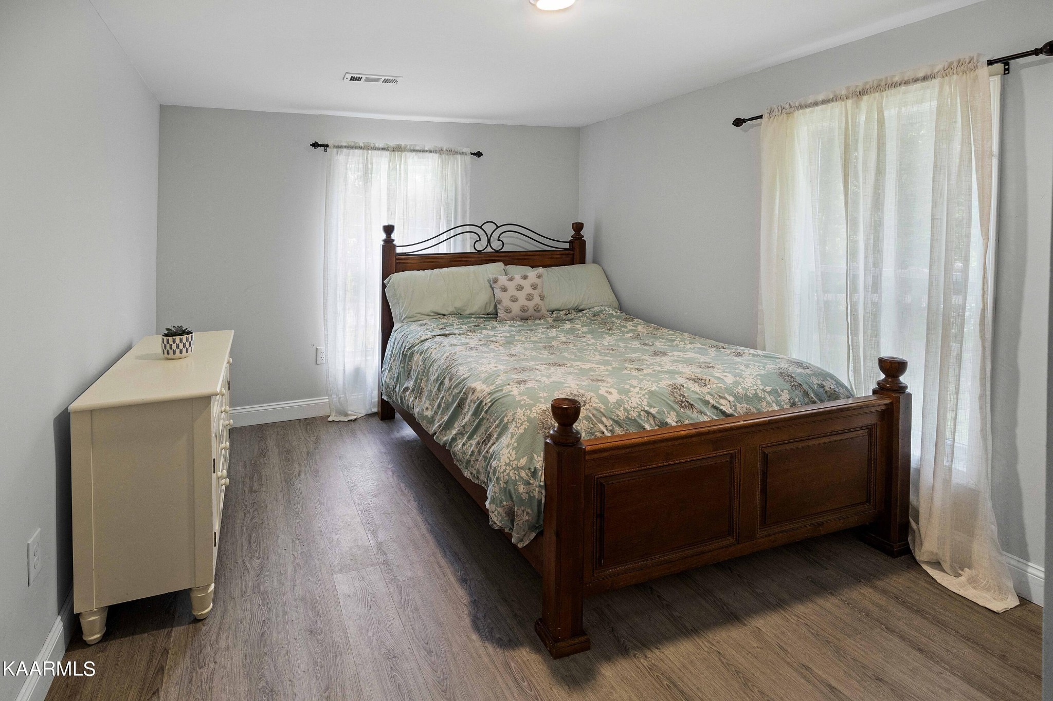 1000 Tarklin Valley Road Knoxville, TN 37920 - Photo 18 of 26 a bed sitting in a bedroom next to a window