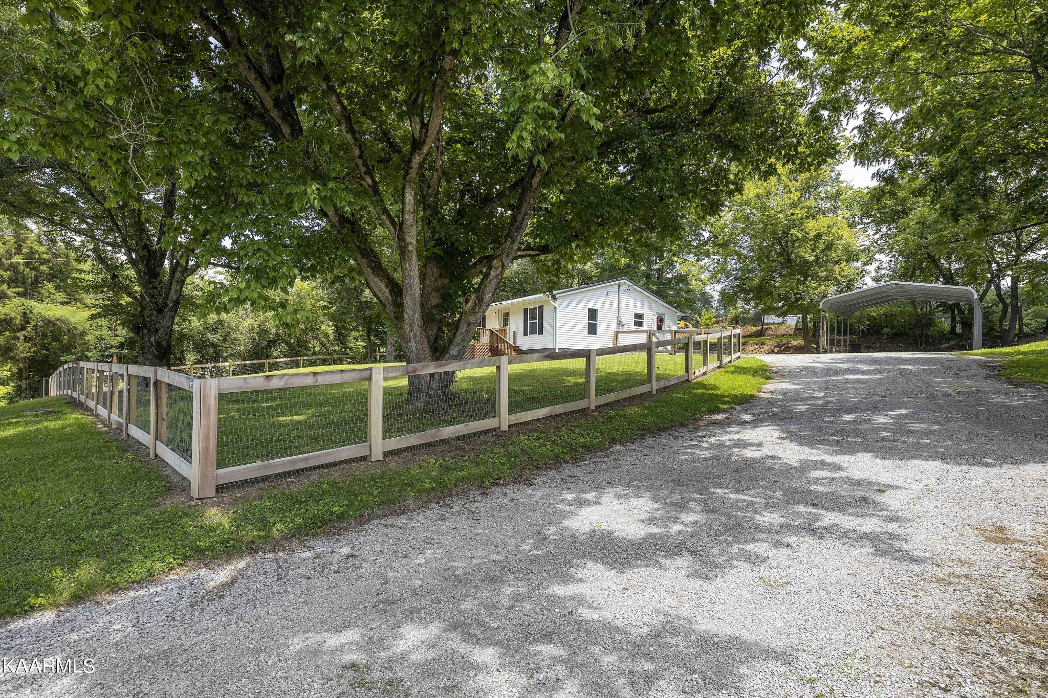 1000 Tarklin Valley Road Knoxville, TN 37920 - Photo 2 of 26 a view of a house with backyard and porch