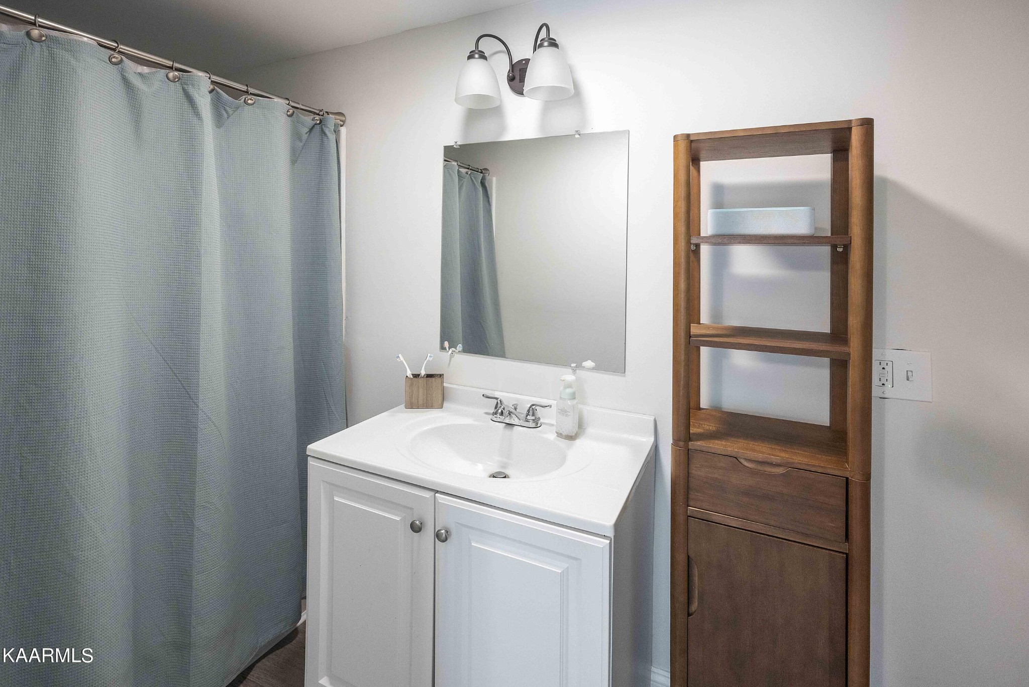 1000 Tarklin Valley Road Knoxville, TN 37920 - Photo 21 of 26 a bathroom with a sink and a mirror