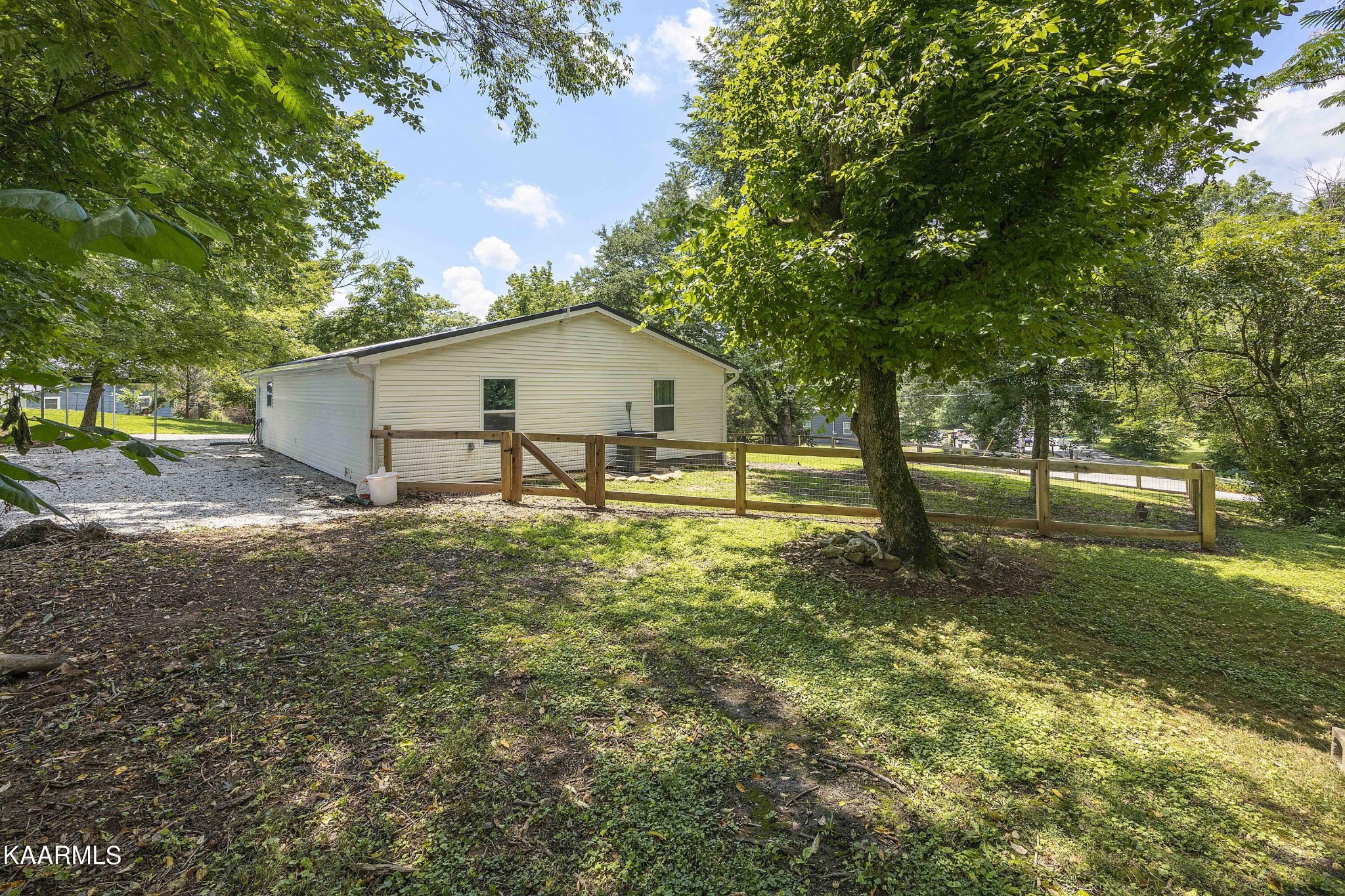 1000 Tarklin Valley Road Knoxville, TN 37920 - Photo 22 of 26 a view of a house with backyard and trees