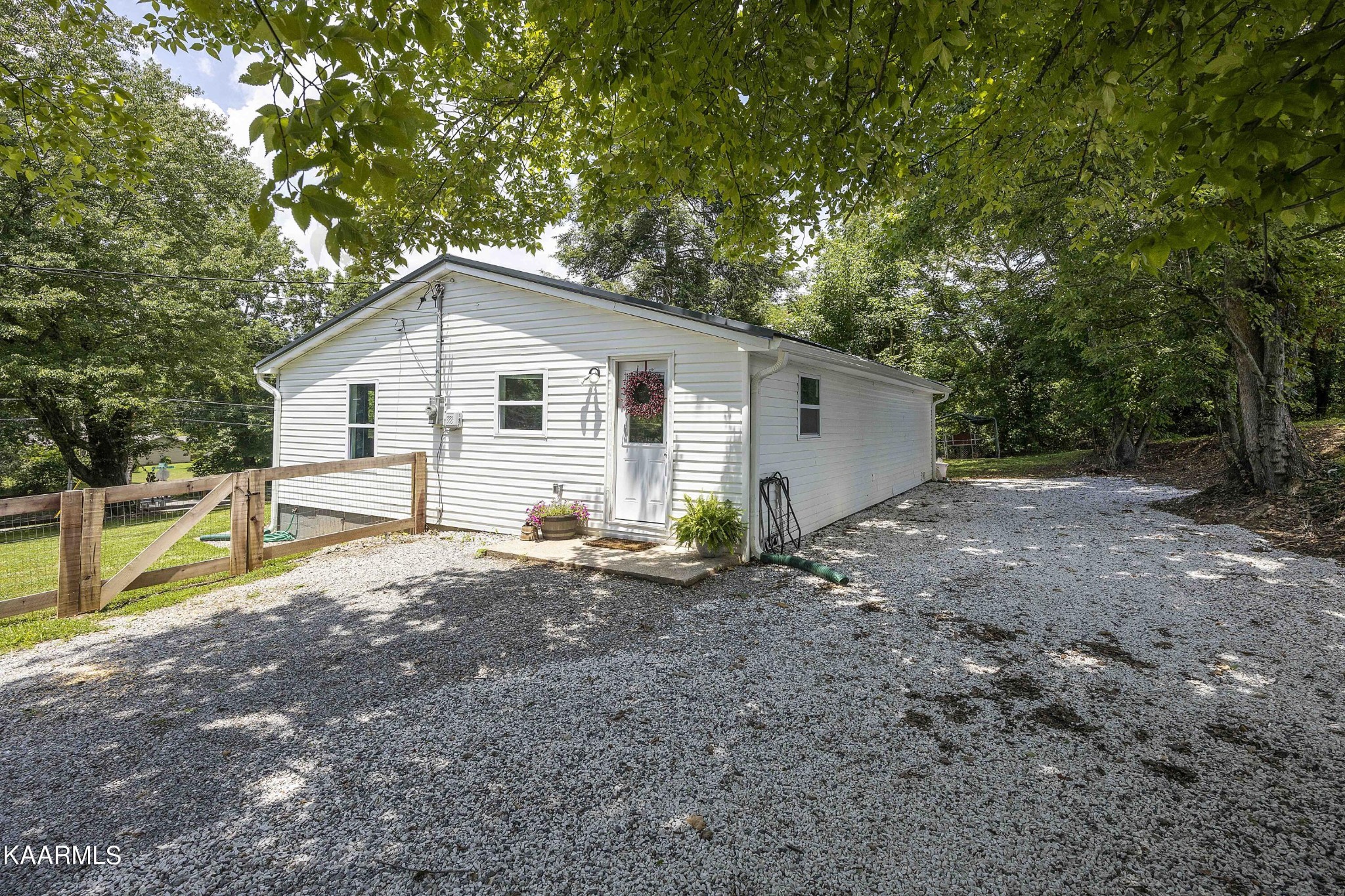 1000 Tarklin Valley Road Knoxville, TN 37920 - Photo 4 of 26 a view of a house with a backyard and trees