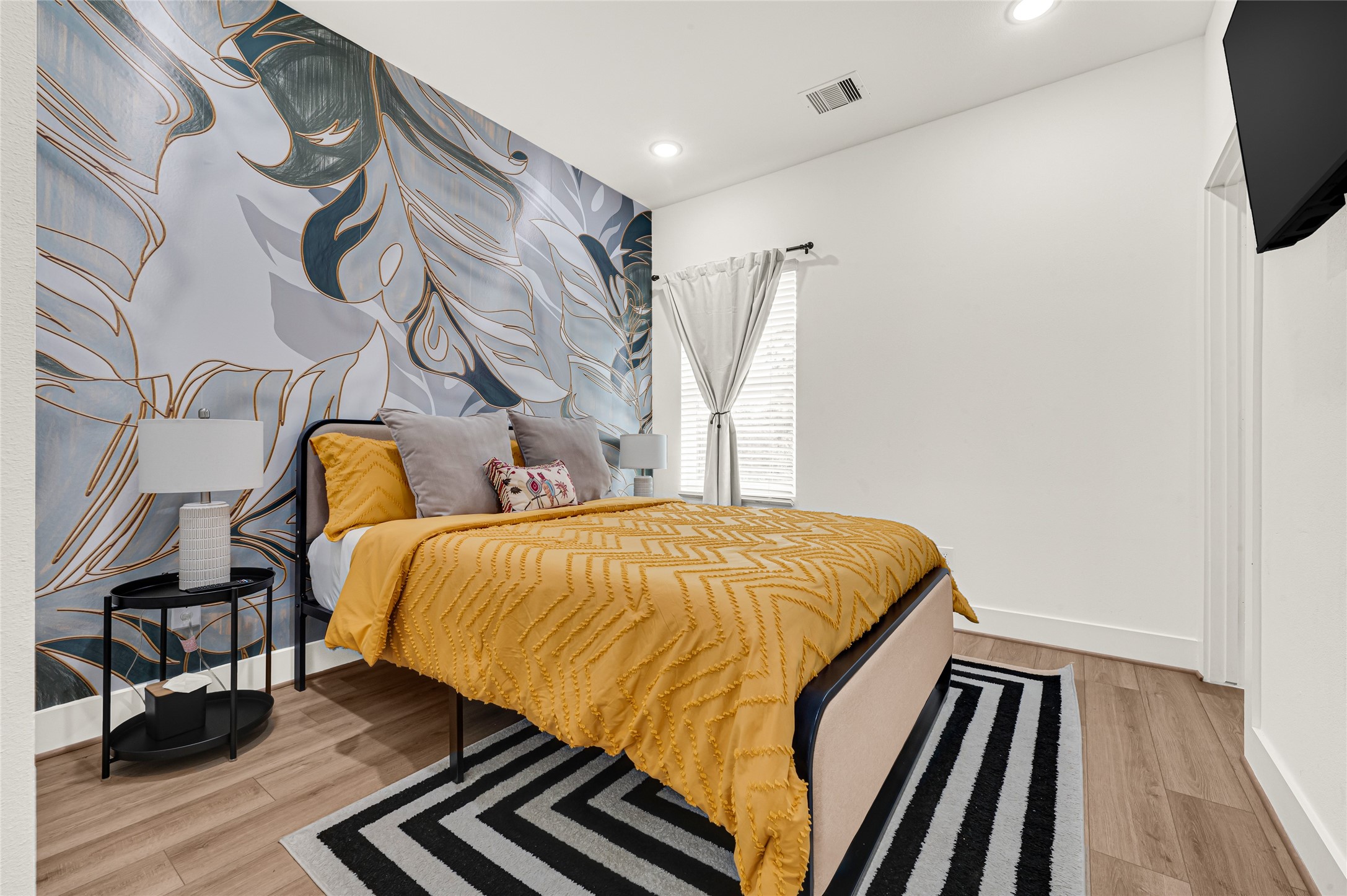 4201 Stassen Street Houston, TX 77051 - Photo 33 of 39 a bedroom with a bed and wooden floor