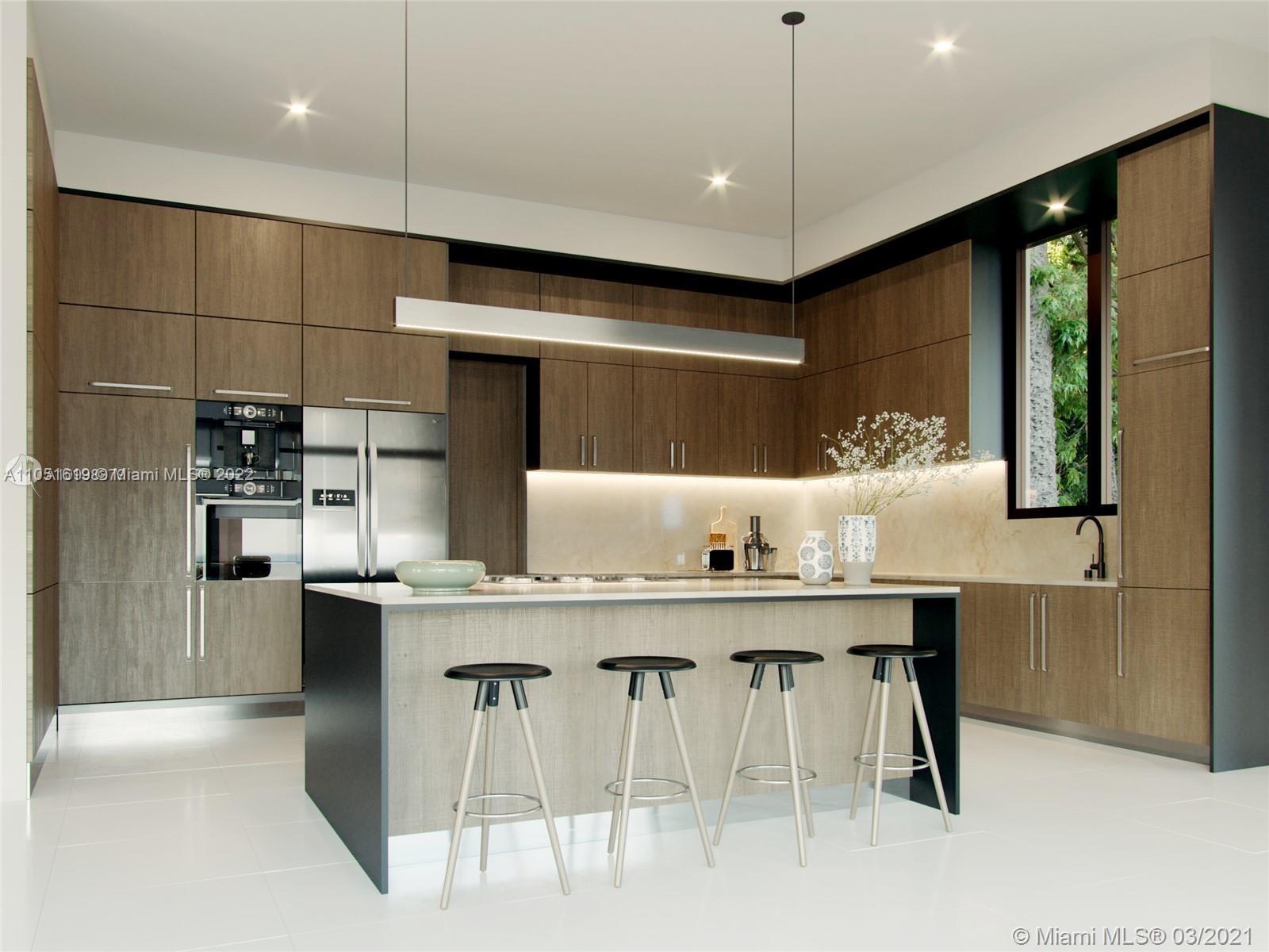 12680 Maple Road North Miami, FL 33181 - Photo 2 of 4 a kitchen with kitchen island cabinets and chairs