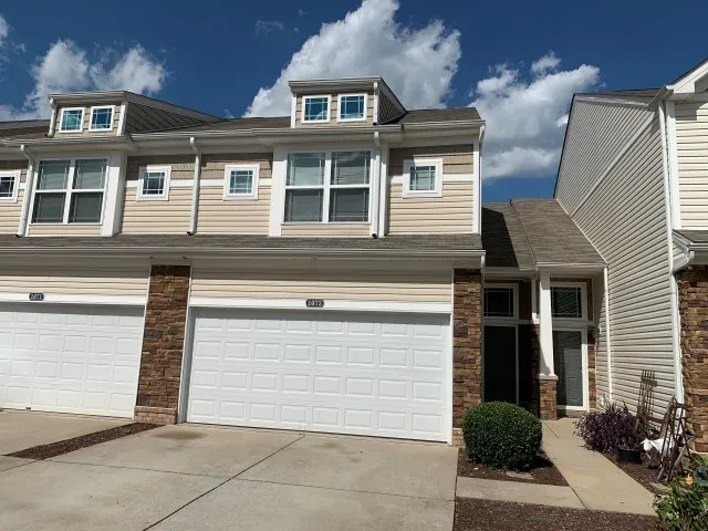 a view of outdoor space garage and residential houses