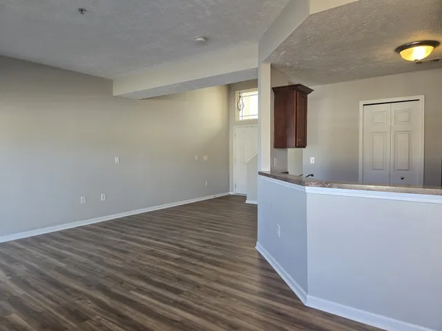 a bathroom with a bathtub sink vanity mirror and toilet