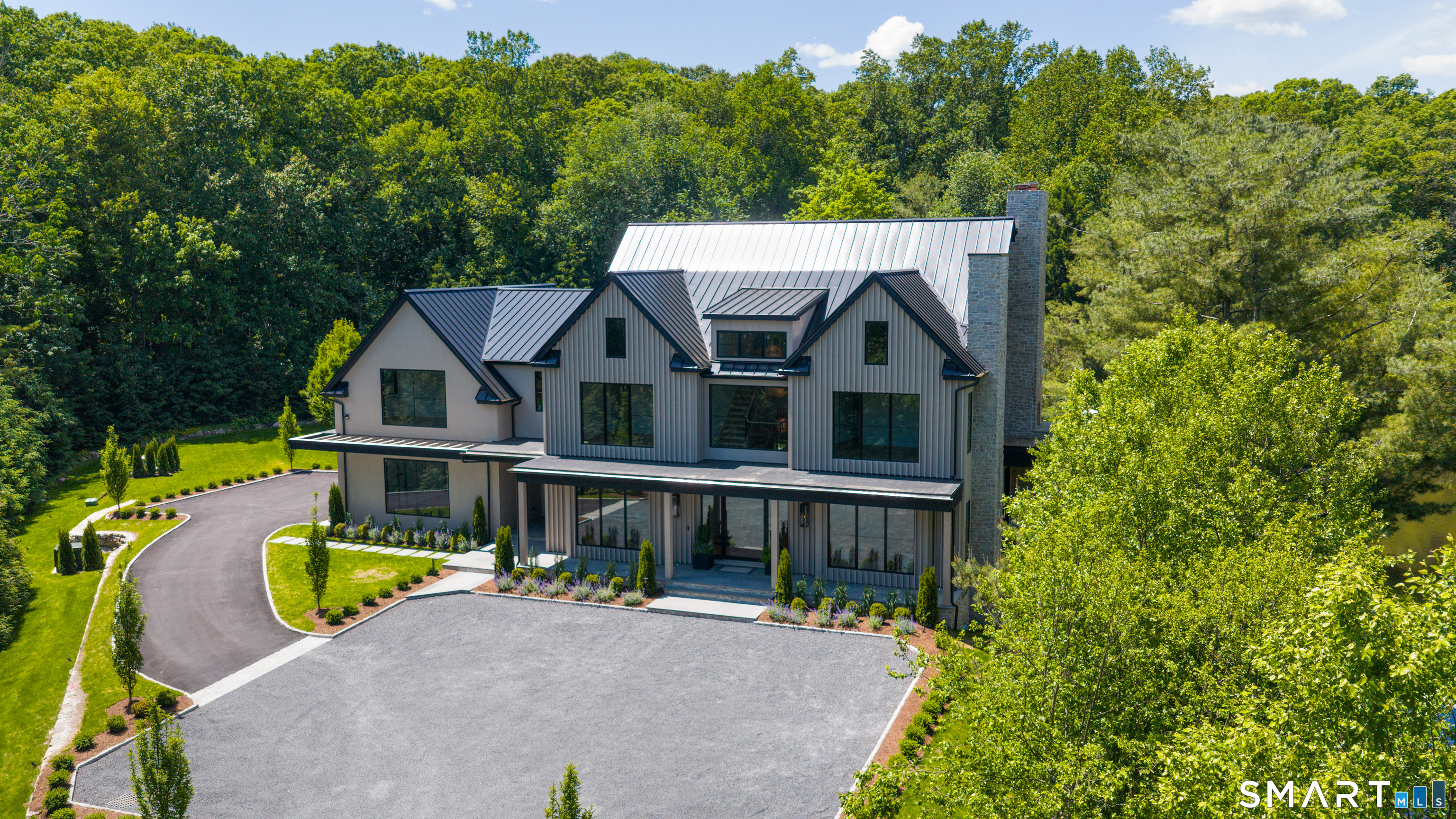 259 Frogtown Road New Canaan, CT 06840 - Photo 4 of 39 an aerial view of a house with swimming pool next to a yard