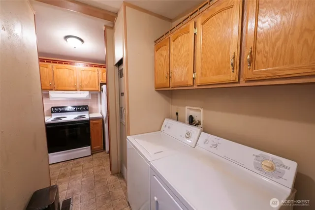 a kitchen with a refrigerator and a sink