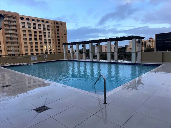 a view of a swimming pool with seating area