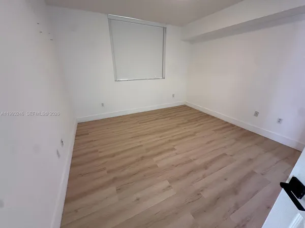 wooden floor in a hall with an entryway