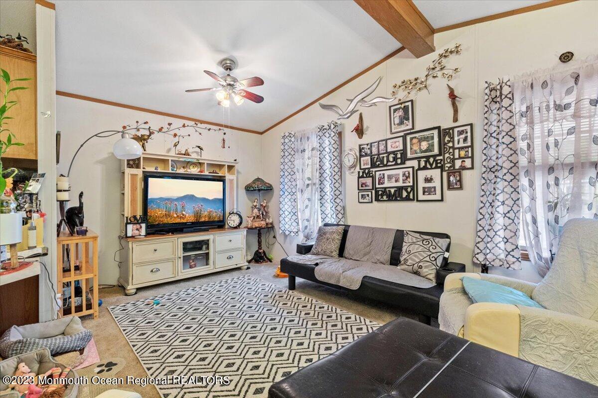 20 Roberts Road Toms River, NJ 08755 - Photo 5 of 17 a living room with furniture and a flat screen tv
