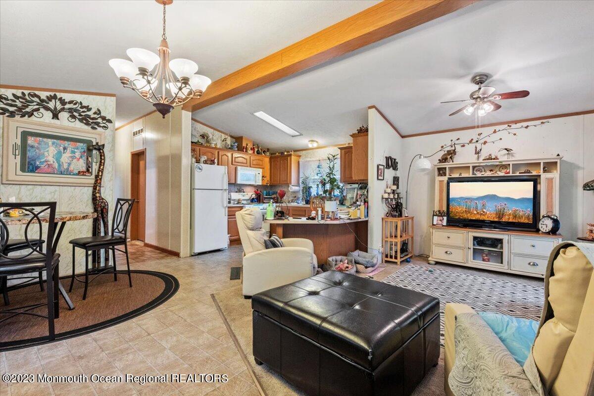 20 Roberts Road Toms River, NJ 08755 - Photo 6 of 17 a living room with furniture and a flat screen tv
