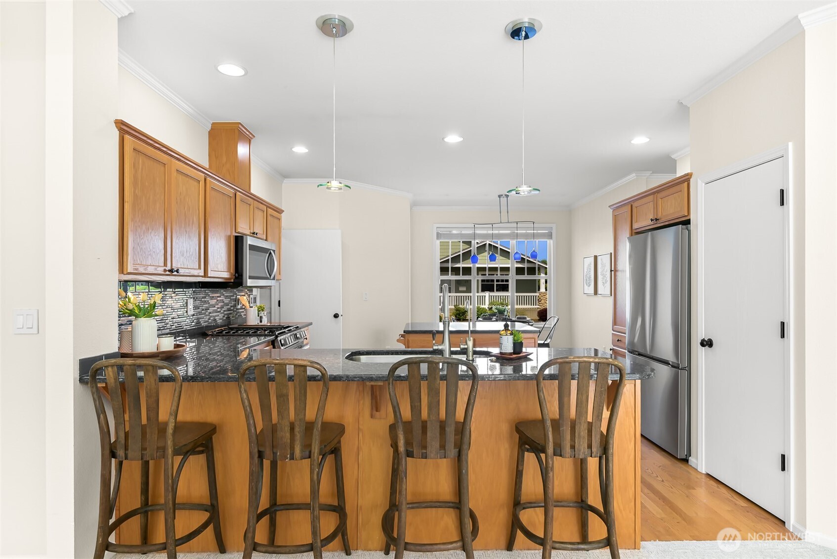 500 Fieldstone Loop, Unit 14 Lynden, WA 98264 - Photo 12 of 25 a kitchen with stainless steel appliances granite countertop a refrigerator and microwave