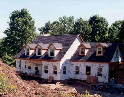 10 Wimisink Road Sherman, CT 06784 - Photo 1 of 1 a view of a big house with large windows and a small yard