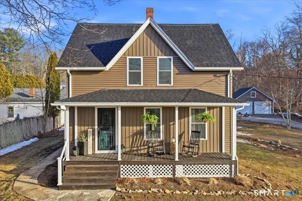a view of a brick house with large windows