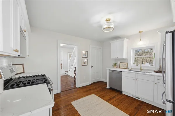 a kitchen with a stove and a microwave