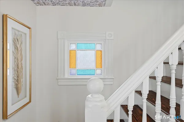 a view of hallway with wooden floor