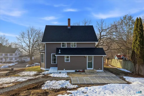 a view of house with outdoor space and garden