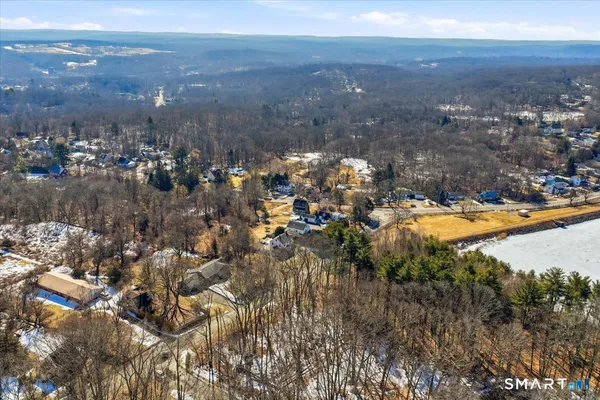 an aerial view of residential house and lake view