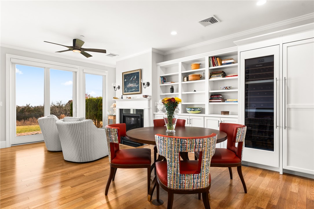 5 Compass Way, Unit C102 Westerly, RI 02891 - Photo 2 of 21 Living room with Miele wine refrigerator and Miele freezer (right of bookshelves)