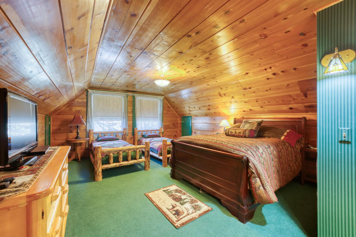 42025 Tollhouse Road Shaver Lake, CA 93664 - Photo 54 of 64 a bed room with a bed and a television