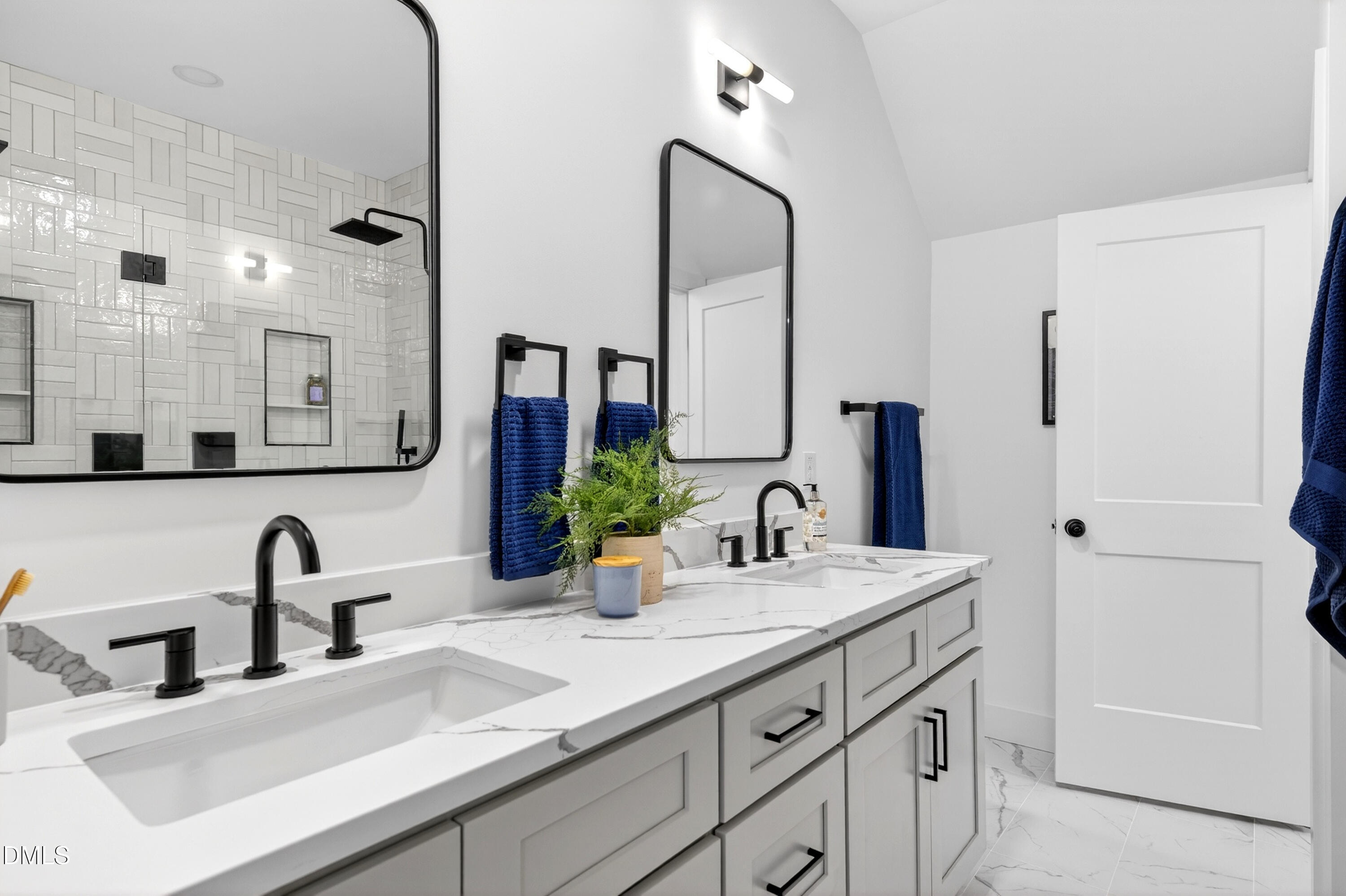 2944 Chapel Hill Road Durham, NC 27707 - Photo 27 of 41 a bathroom with double vanity sink and a mirror