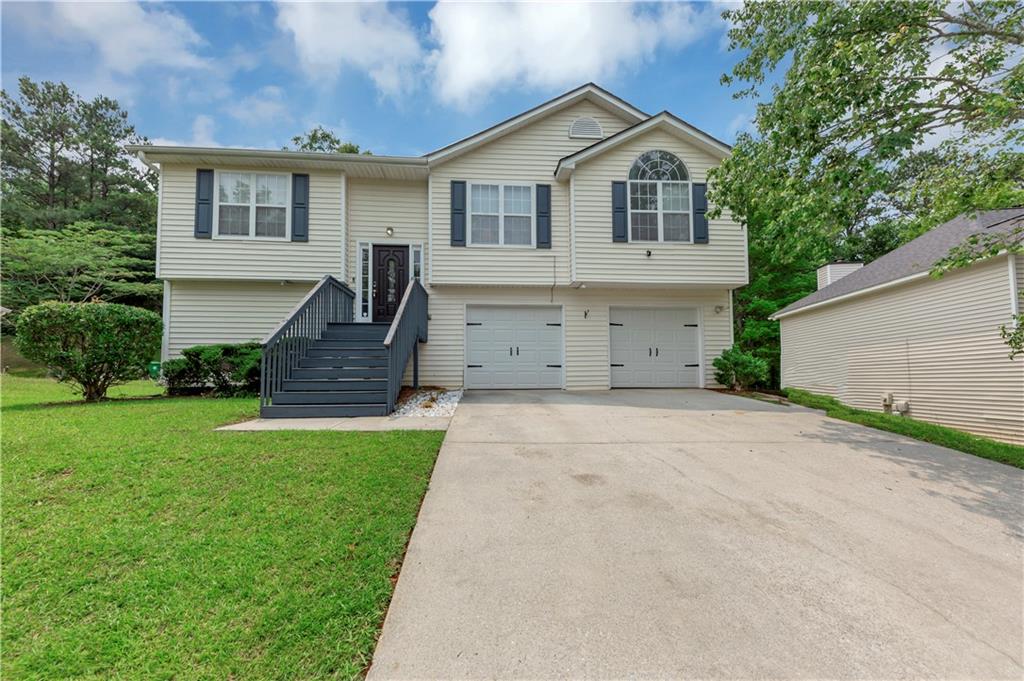 2880 Field Spring Drive Lithonia, GA 30058 - Photo 1 of 31 a front view of house with yard