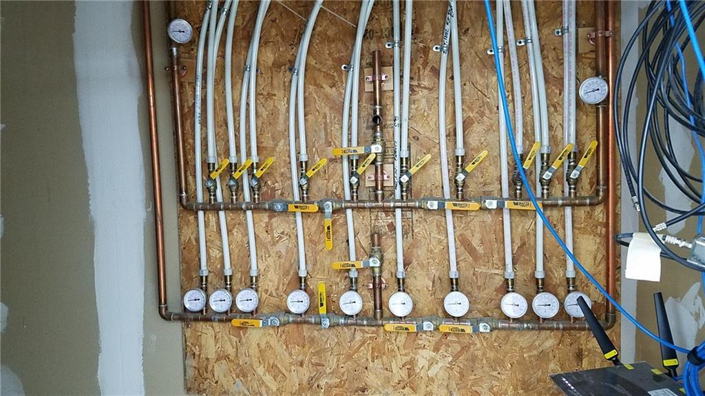 2269 Chapman Road Mapleton, ME 04757 - Photo 34 of 35 The in floor radiant heat manifolds...