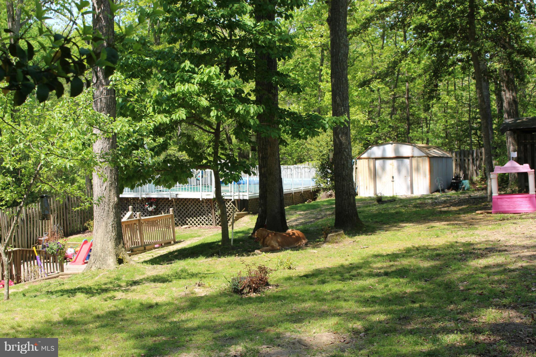 330 Red Cloud Road Lusby, MD 20657 - Photo 10 of 30 a view of a house with a yard
