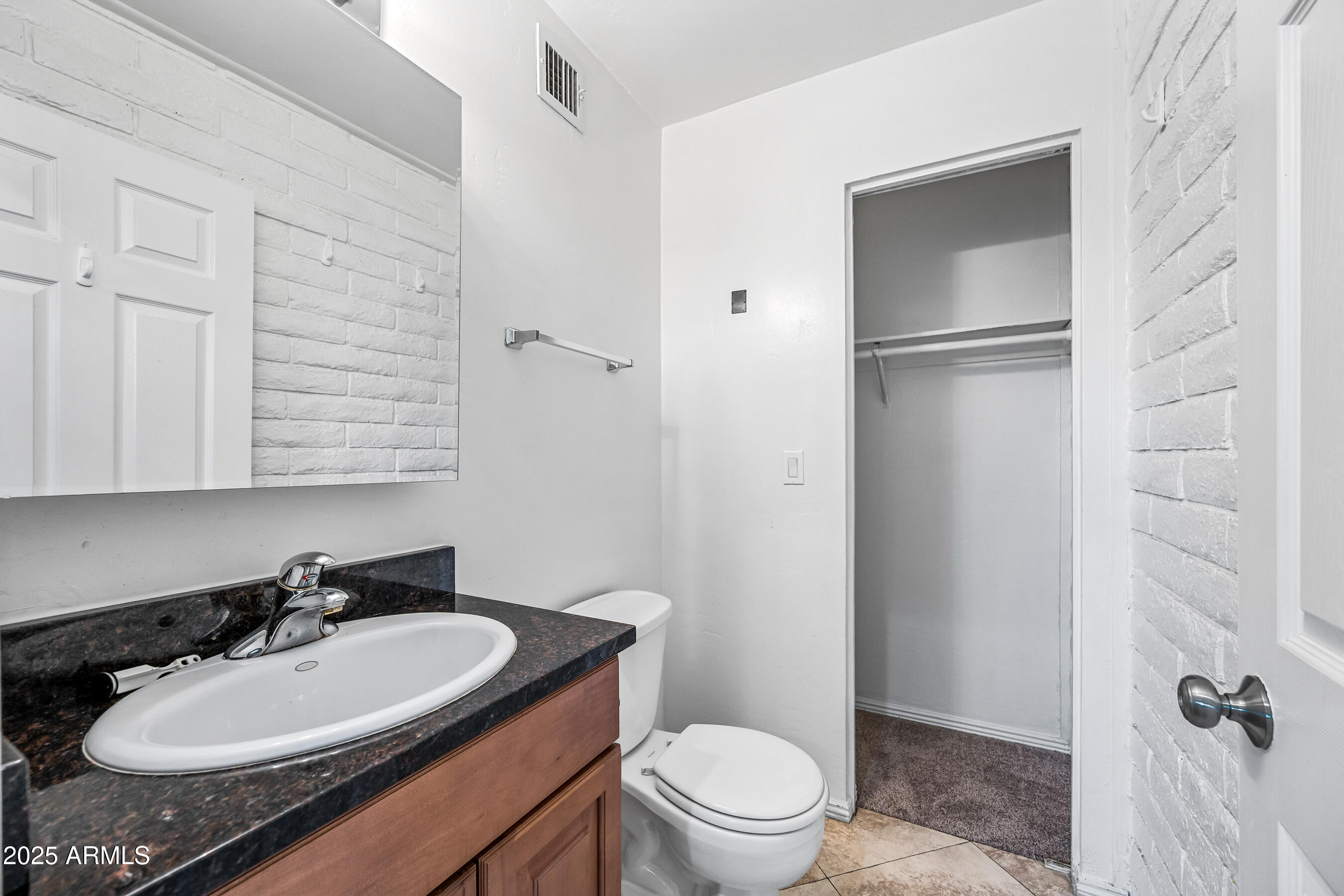 1234 North 36th Street, Unit 109 Phoenix, AZ 85008 - Photo 13 of 16 a bathroom with a sink a toilet and shower