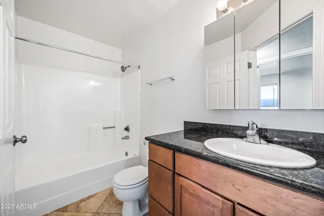 a view of livingroom with washer and dryer
