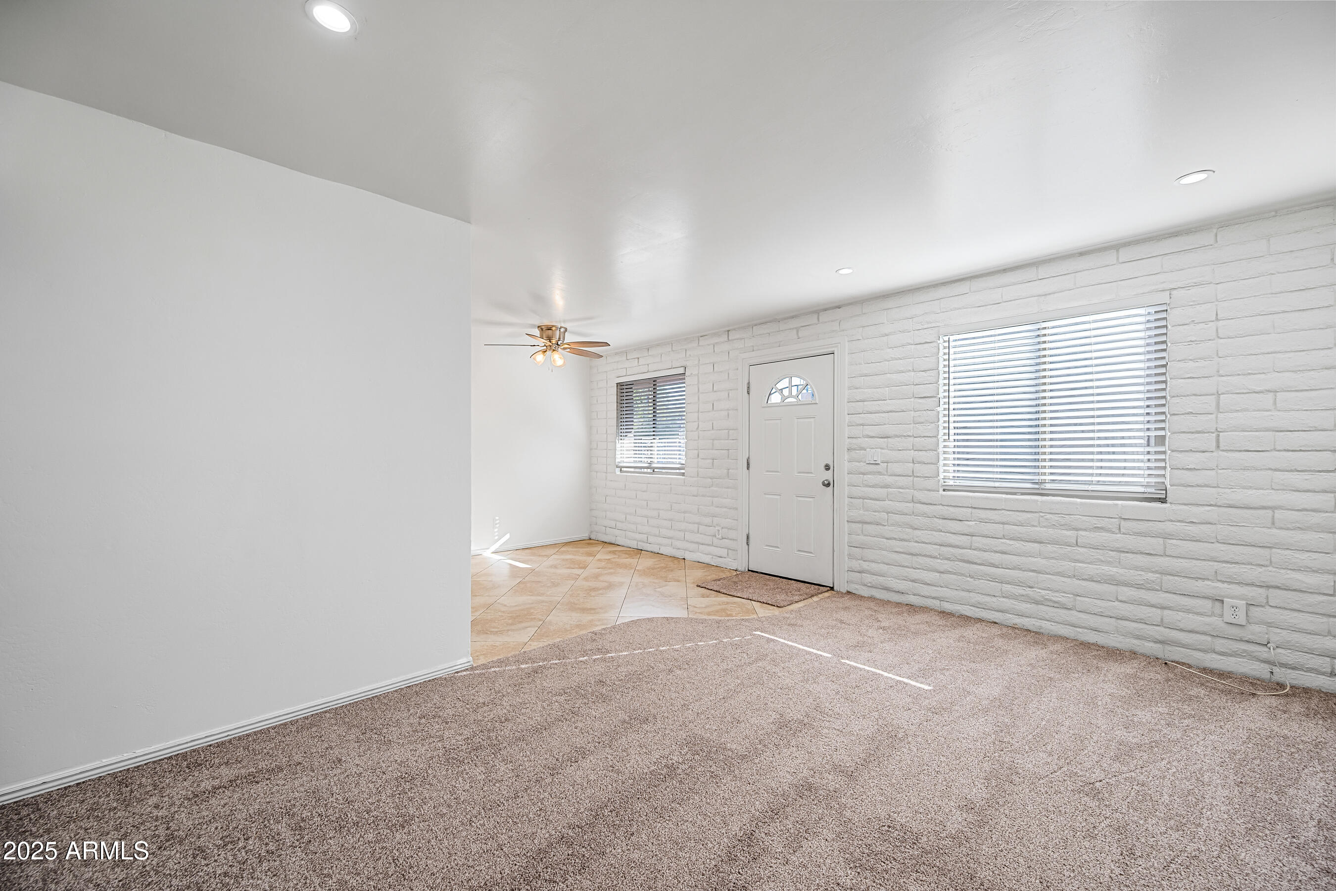 1234 North 36th Street, Unit 109 Phoenix, AZ 85008 - Photo 4 of 16 an empty room with windows