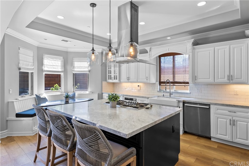 2210 Robinson Street Redondo Beach, CA 90278 - Photo 14 of 39 a kitchen with a sink a stove and chairs