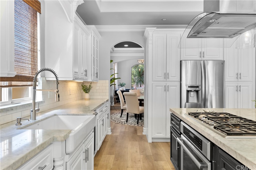 2210 Robinson Street Redondo Beach, CA 90278 - Photo 15 of 39 a kitchen with granite countertop a sink stainless steel appliances and window