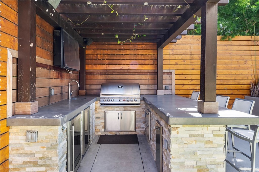 2210 Robinson Street Redondo Beach, CA 90278 - Photo 30 of 39 a kitchen with stainless steel appliances granite countertop a sink and a counter