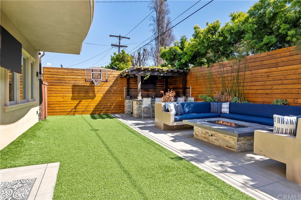 2210 Robinson Street Redondo Beach, CA 90278 - Photo 32 of 39 a view of a backyard with couches chairs and potted plants