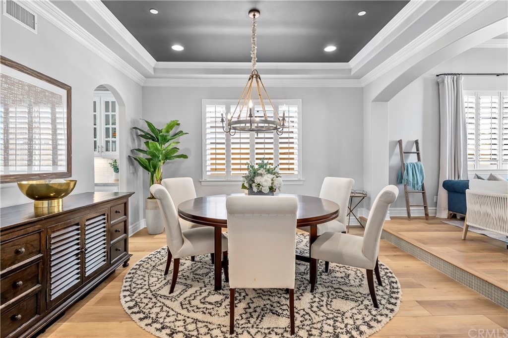 2210 Robinson Street Redondo Beach, CA 90278 - Photo 6 of 39 a dining room with furniture a chandelier and wooden floor